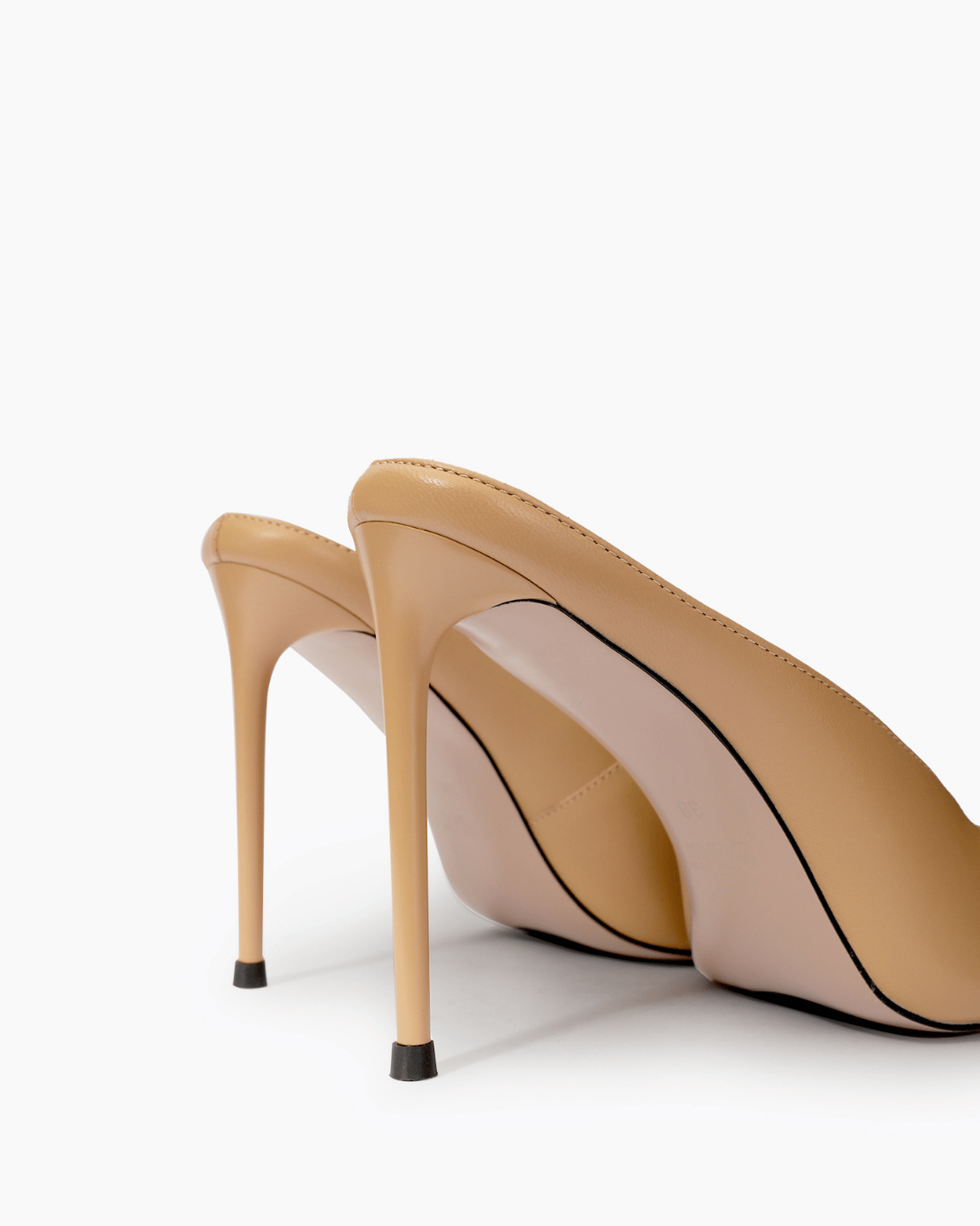 Nude stiletto mule heel and black heel-tip detail