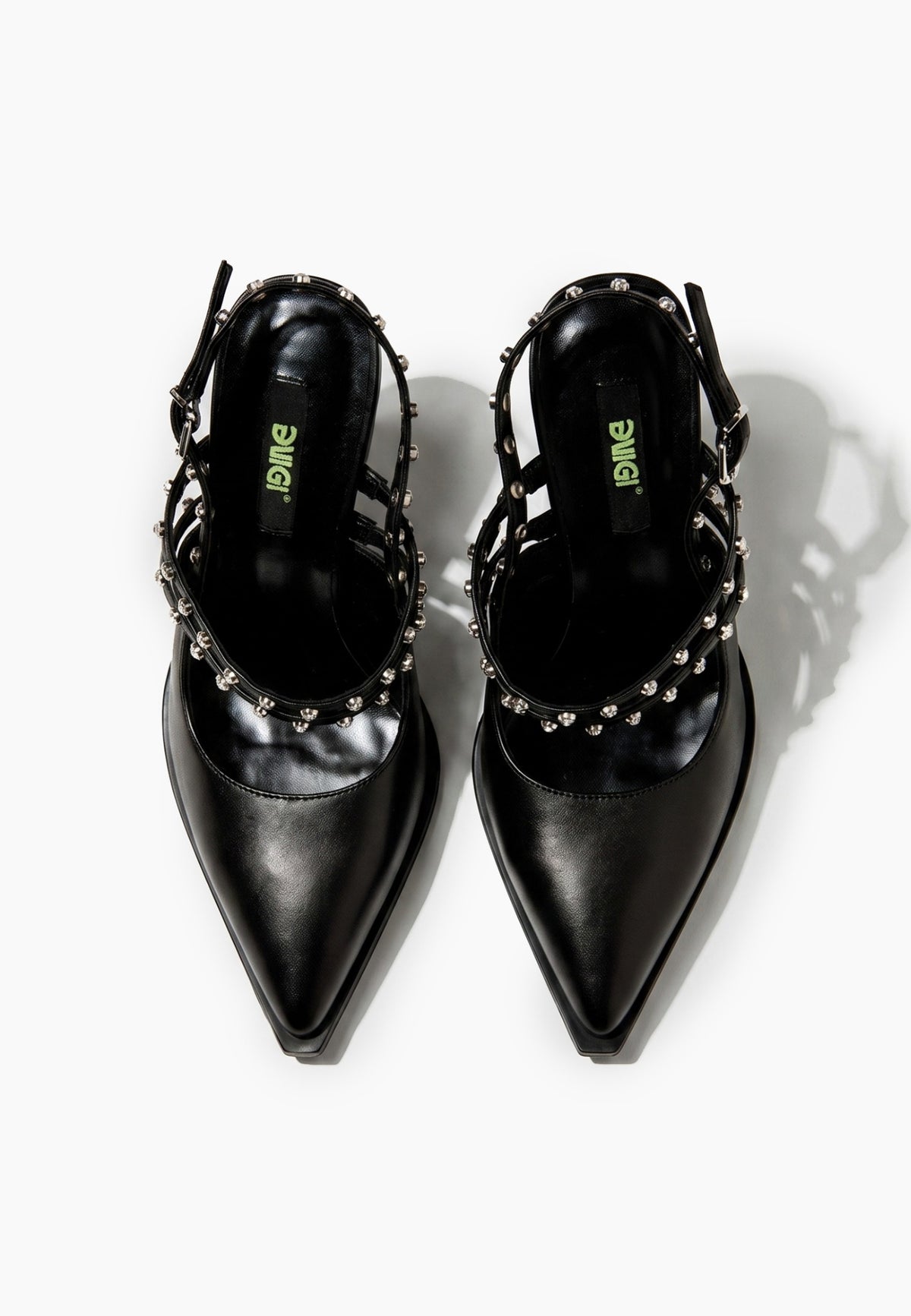 Top view of black leather pointed heels with crystal-set straps