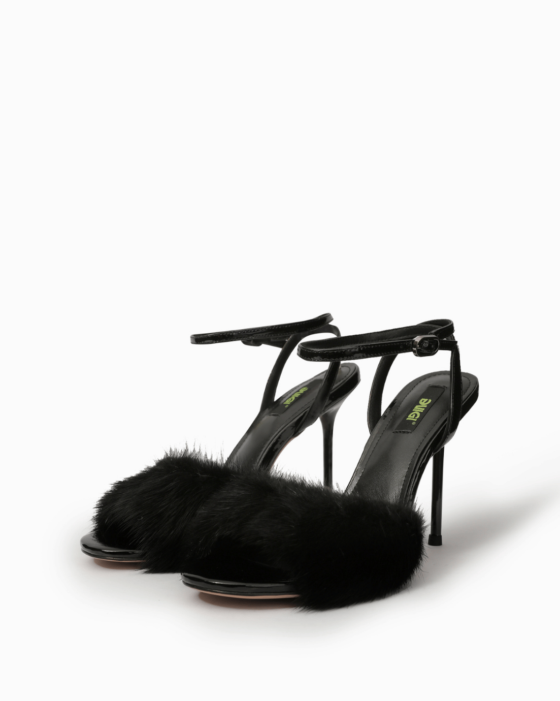 Pair of black natural fur ankle-strap high heel sandals