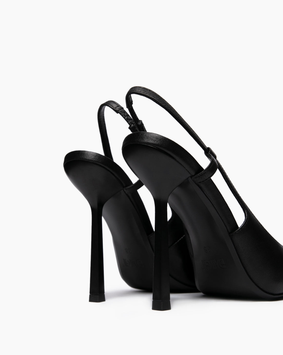 Rear view of black leather slingback heels showing slim straps and high flared stilettos