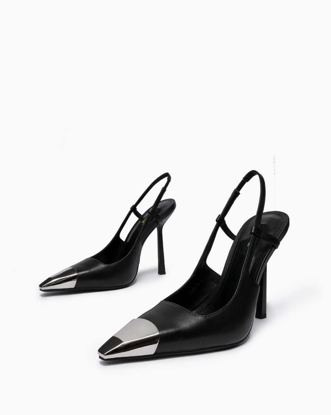 Angled pair of black pointed slingback heels with silver-tone metal toe caps