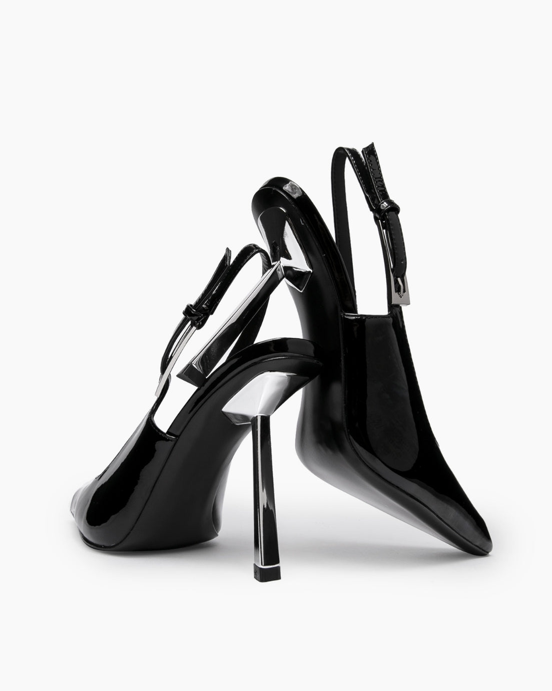 Black patent leather slingback pumps showing the curved profile and clear geometric heel detail