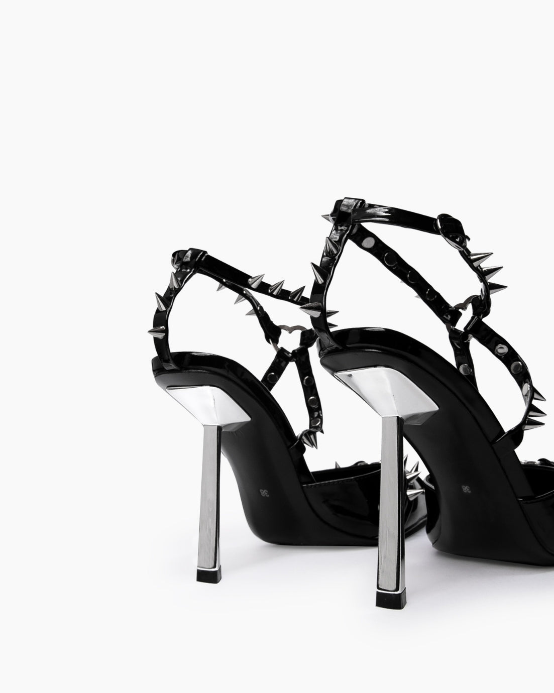Black spiked heels — silver-tone sculptural heels and rear strap detail