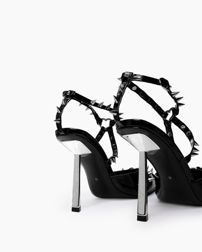 Black spiked heels — silver-tone sculptural heels and rear strap detail