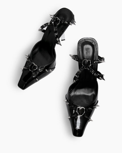 Black EVIGI patent leather spiked heels — top view