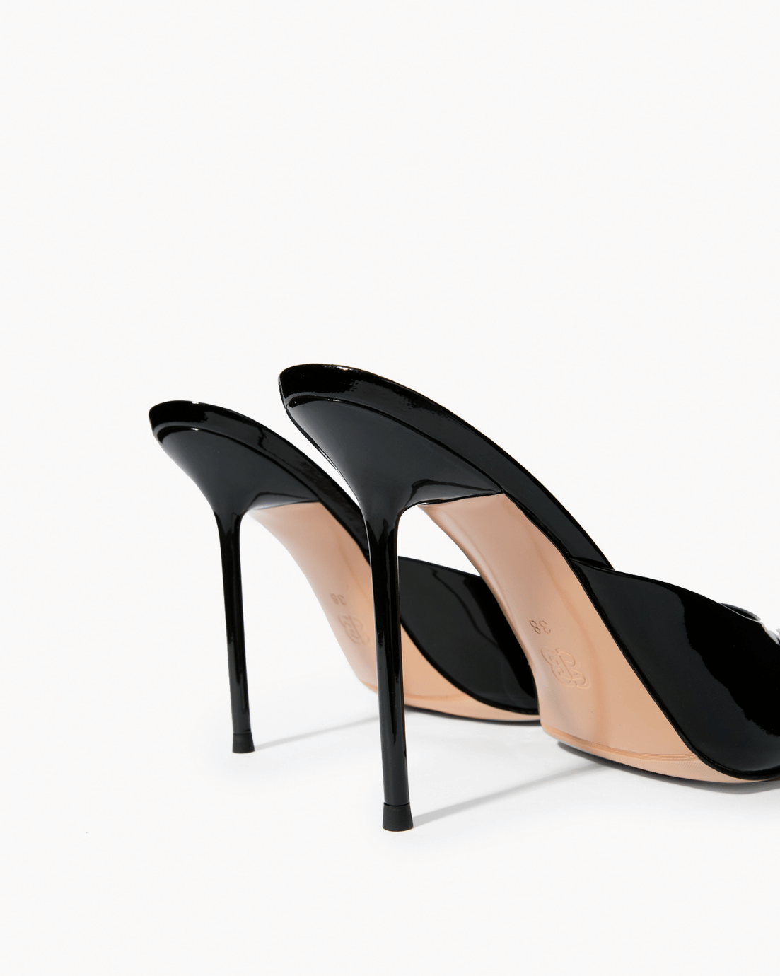 Black patent leather mules, stiletto heel and sole detail