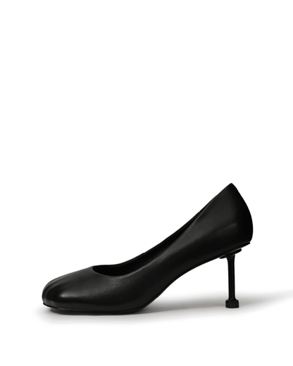 Black square-toe pumps with a sculptural slim heel — side view
