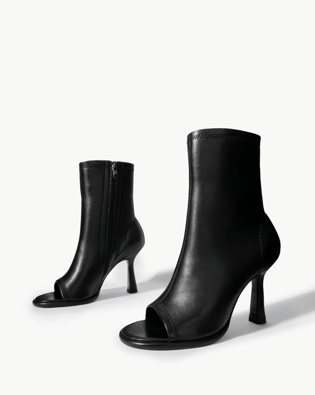 Black stretch-leather ankle boots with side zip