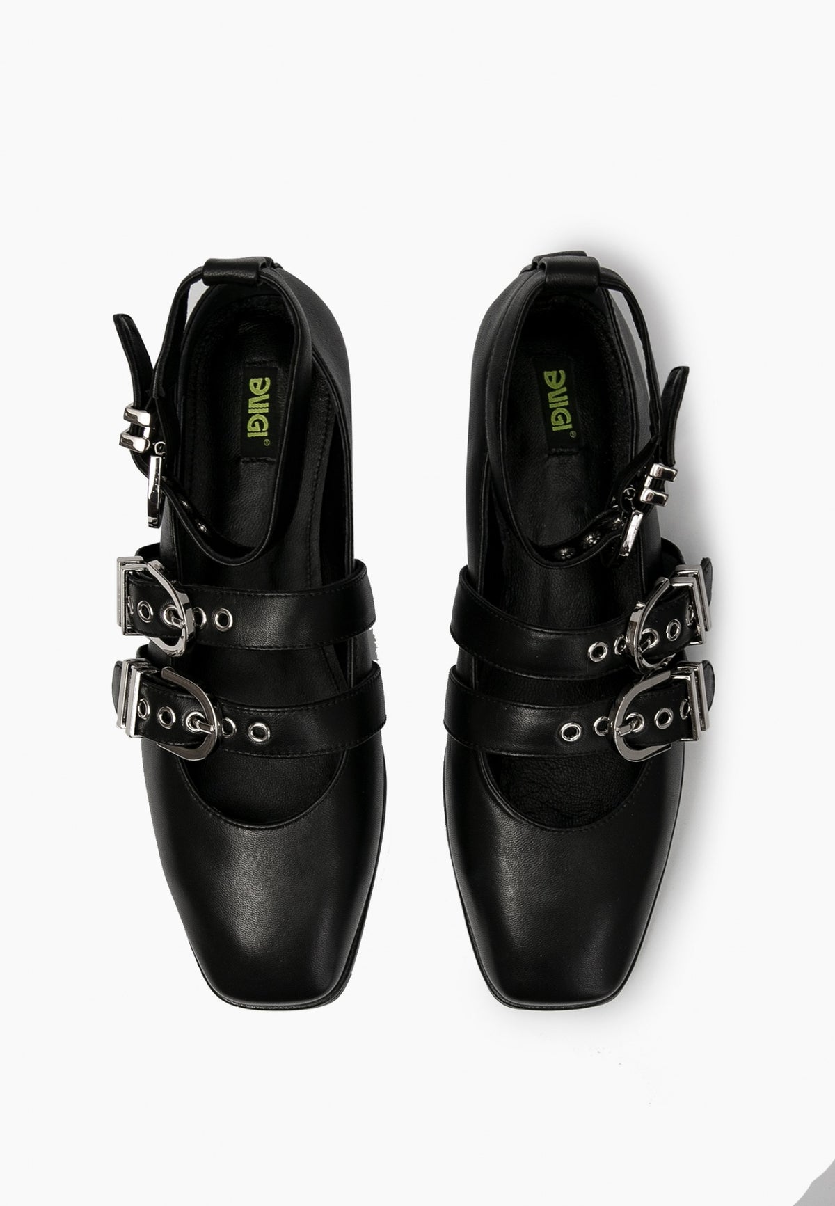 Top view of black leather ballet flats with two instep straps and ankle buckles