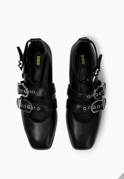 Top view of black leather ballet flats with two instep straps and ankle buckles