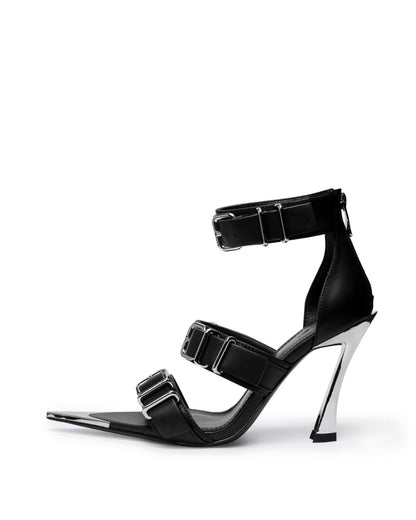 Black leather triple-buckle heels with chrome-coated pointed toe and sculptural high heel, side view