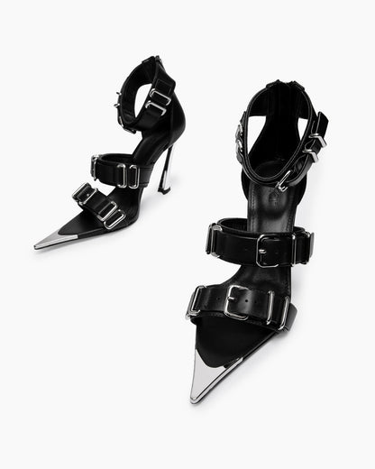 Top view of black leather buckle heels with chrome-coated pointed toe details