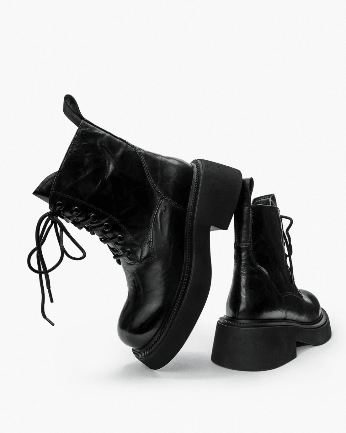 Black vintage leather platform boots, sculpted sole view