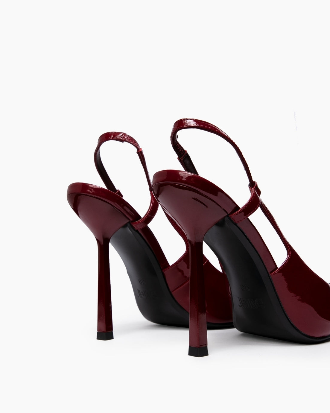 Rear view of burgundy patent slingback heels with narrow high stiletto heels