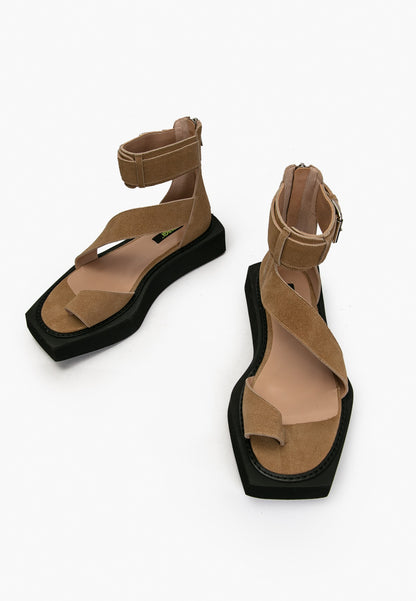 Top view of camel suede sandals with crossover straps and toe loops