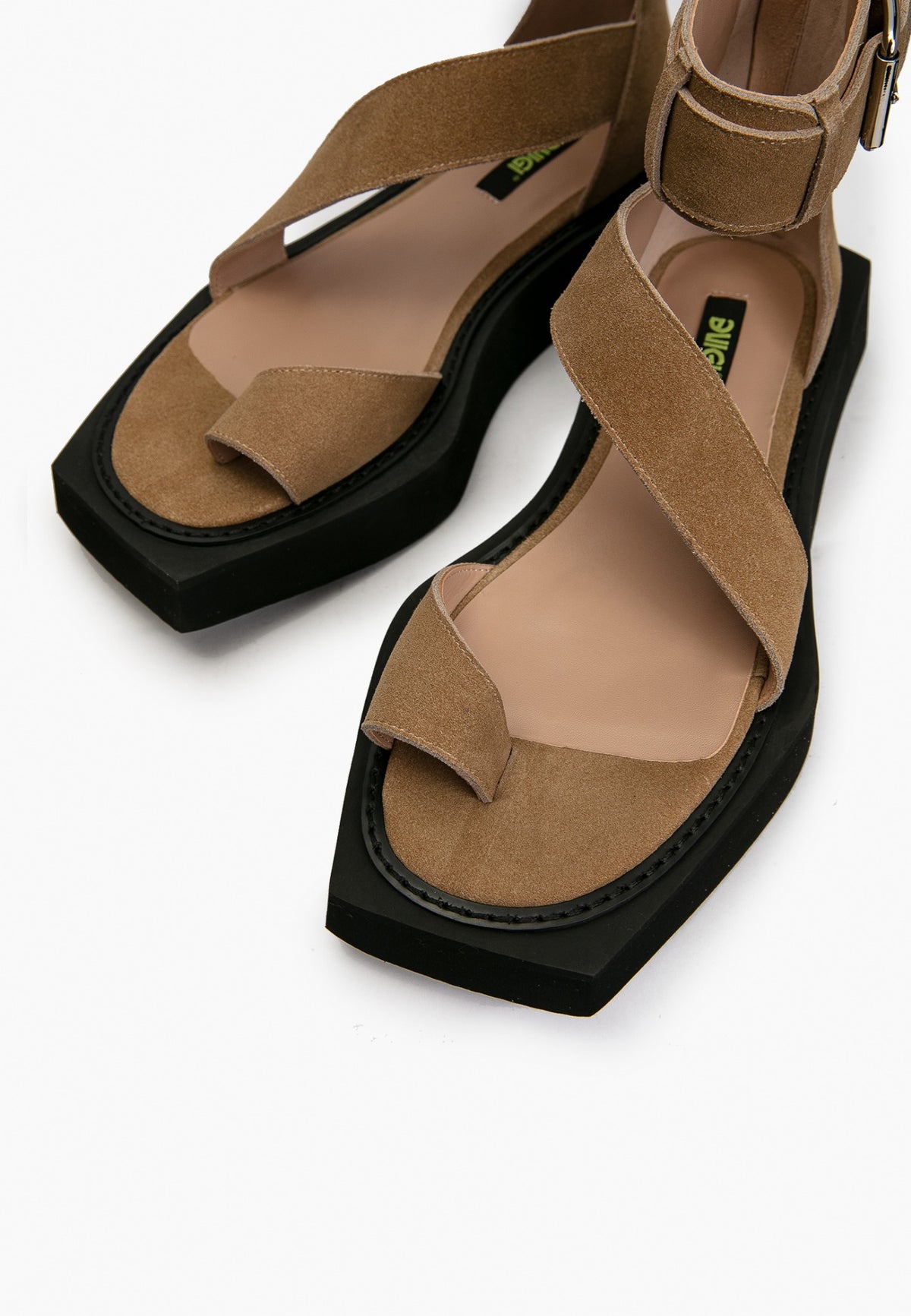 Close-up of camel suede crossover straps, leather insole and square toe