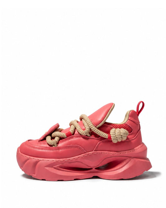 Coral pink chunky sneakers with beige rope laces and sculpted sole, side view