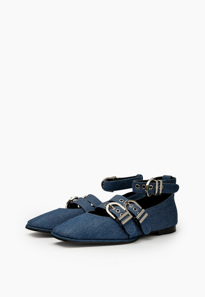 Pair of indigo denim ballet flats with square toes and silver-tone buckle straps