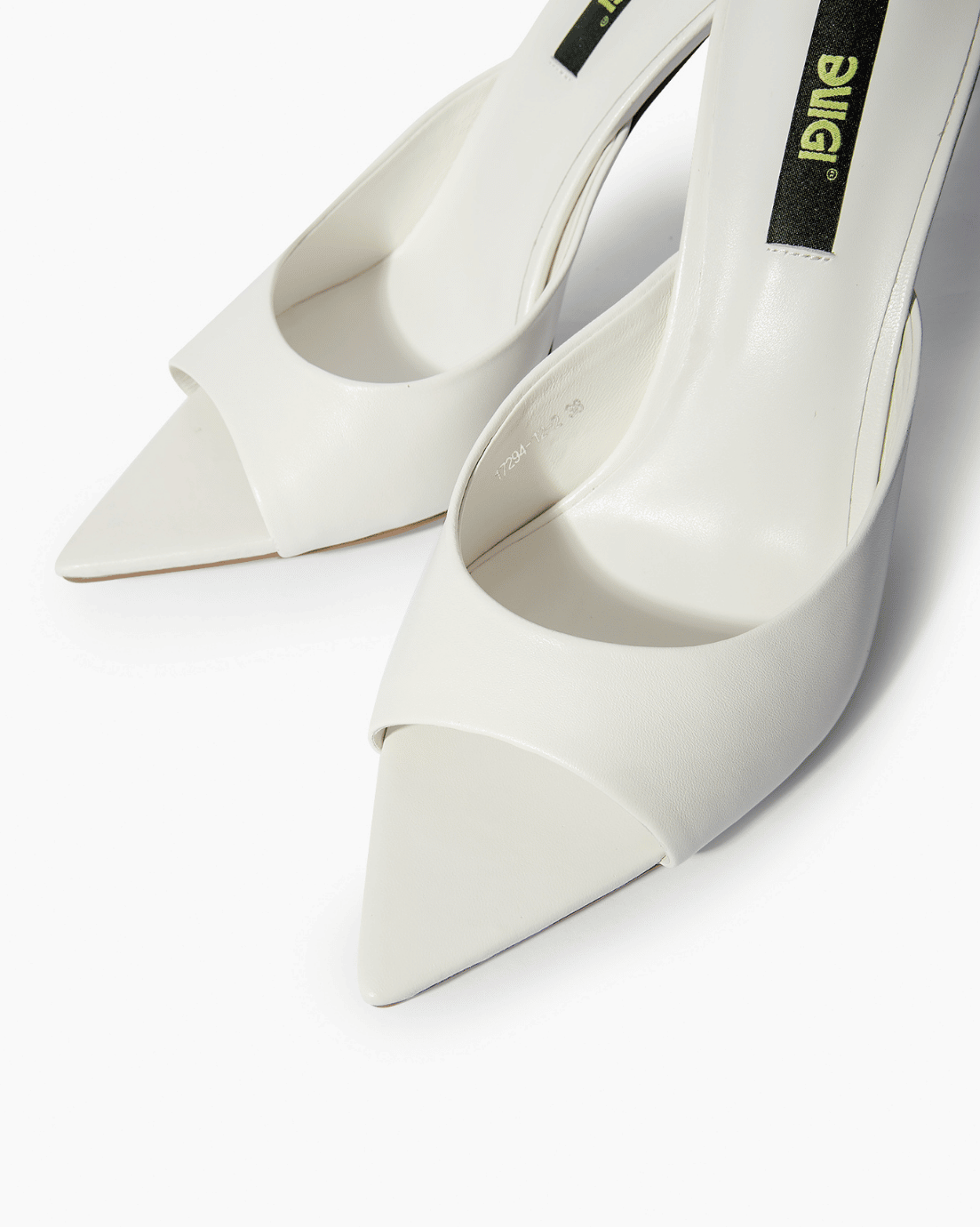 Ivory leather mules with open toe and extended pointed sole detail