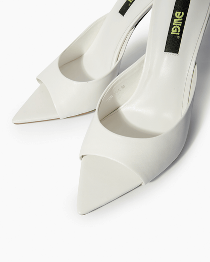 Ivory leather mules with open toe and extended pointed sole detail