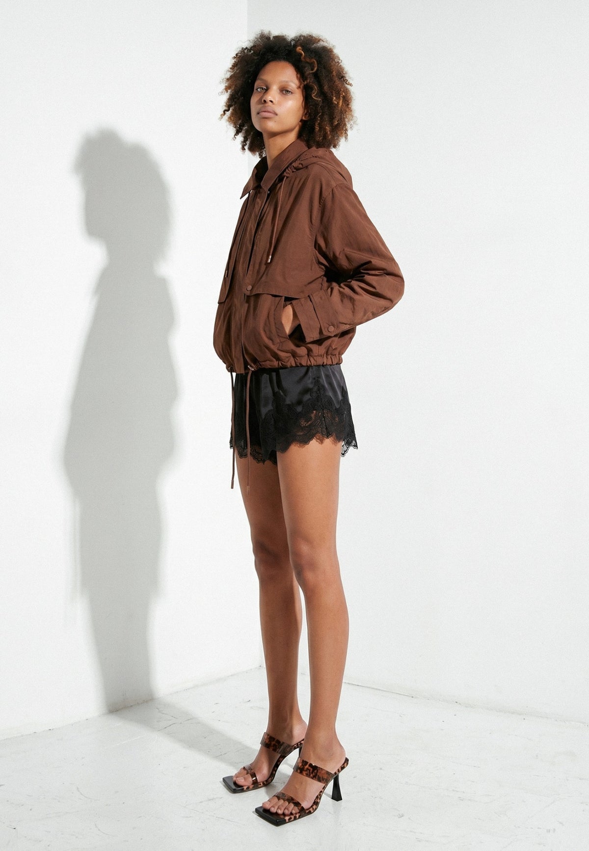 Leopard-print silicone strap heels in a full-length model look
