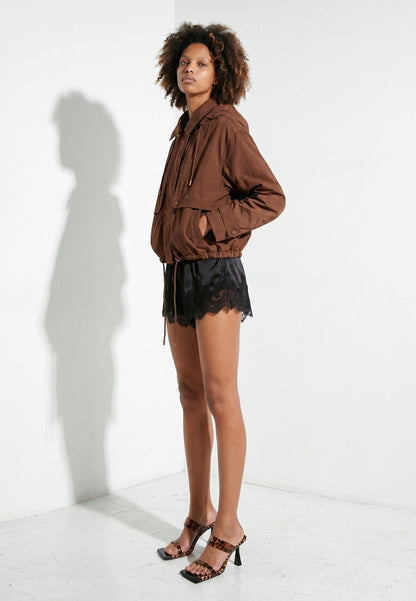 Leopard-print silicone strap heels in a full-length model look