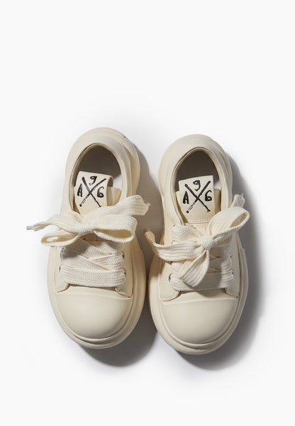 Top view of milky ivory leather platform sneakers with oversized laces
