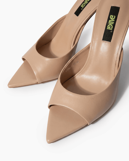 Nude beige leather mules with open toe and extended pointed sole detail