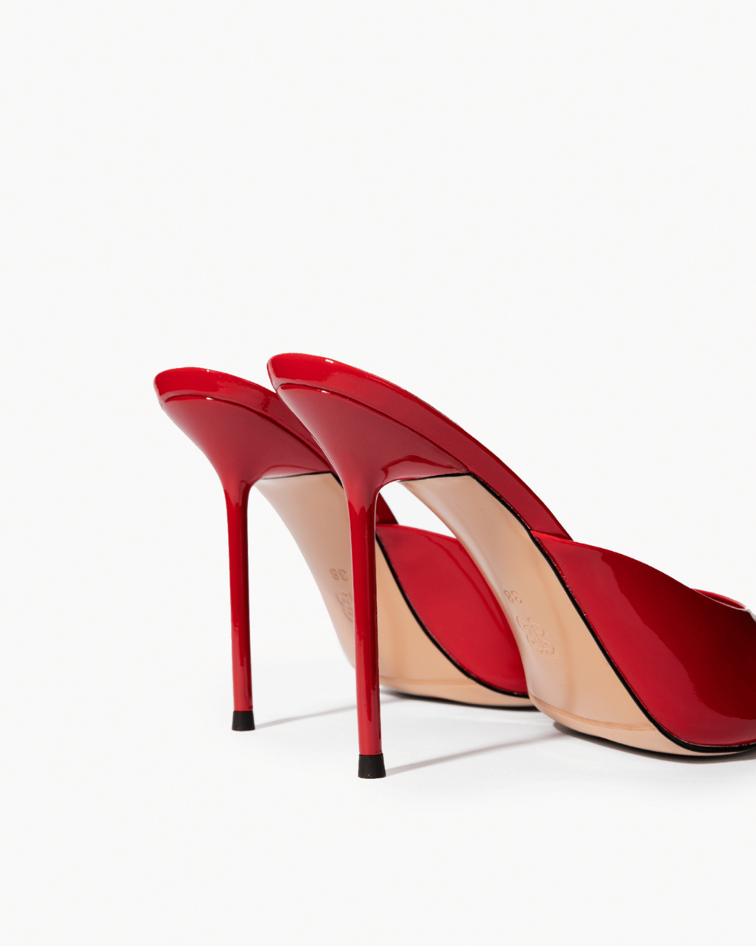 Red patent leather mules, stiletto heel and sole detail