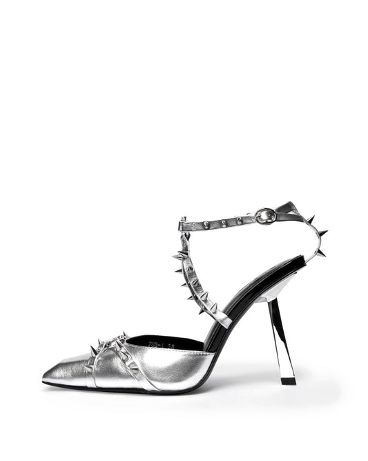 Silver metallic leather heel with spiked ankle straps and an angular heel, side profile